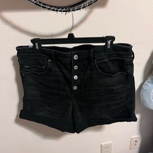 Black denim shorts with buttons